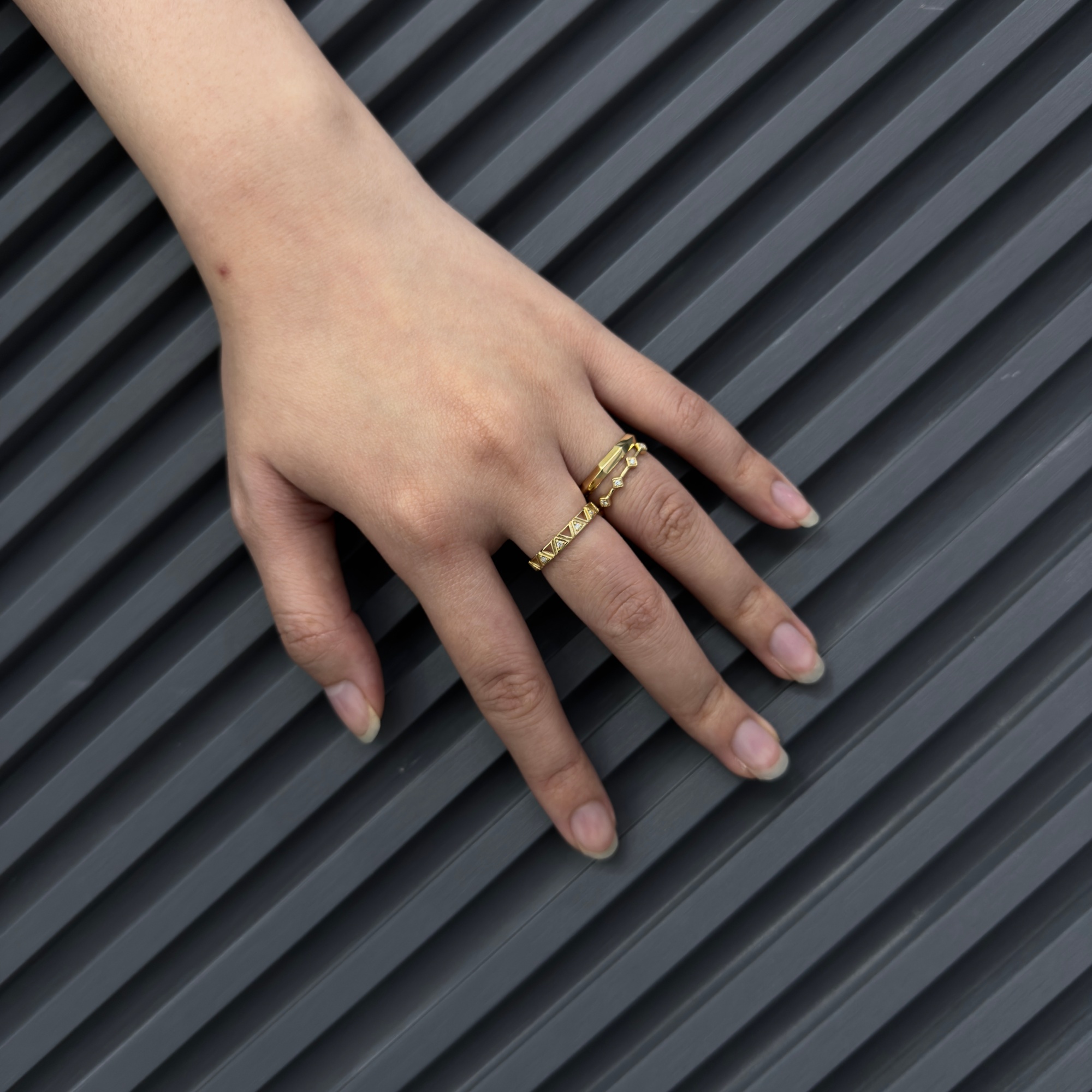 Woman wearing Frank & Label jewellery while reading