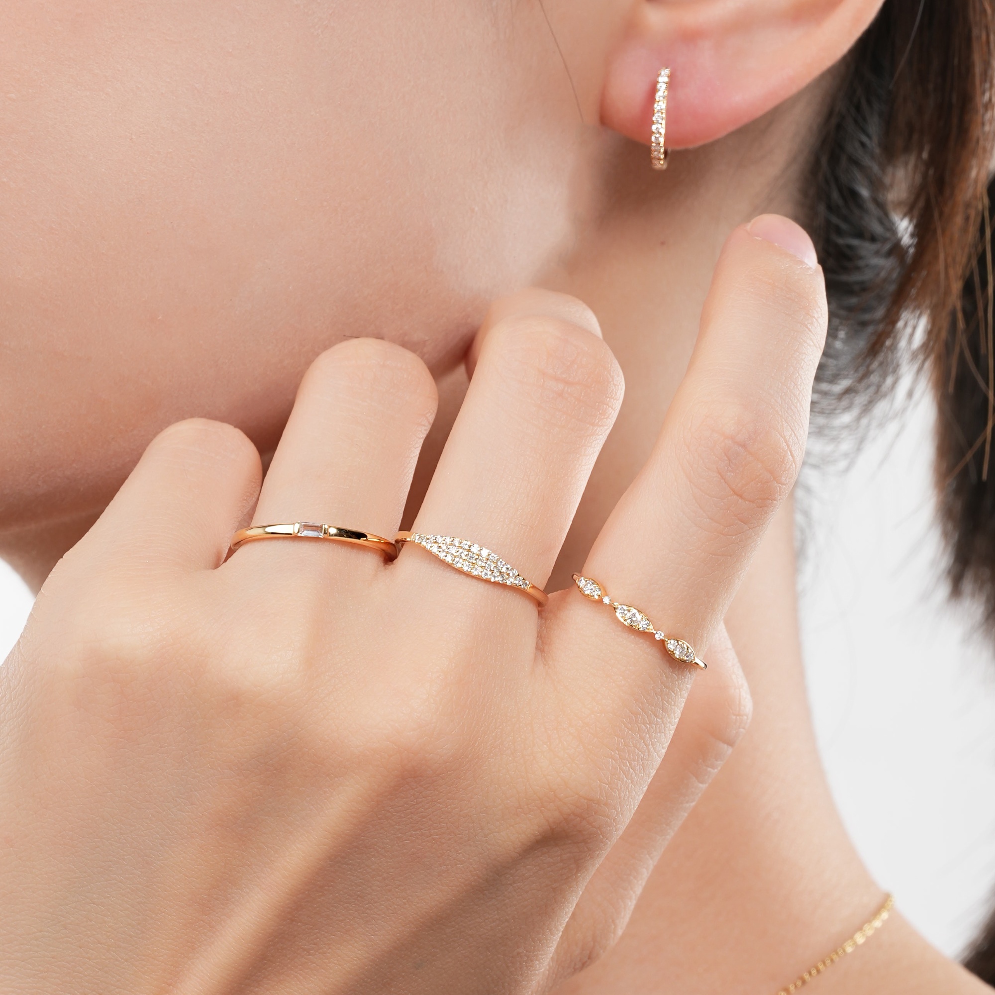 Woman wearing Frank & Label jewellery while reading