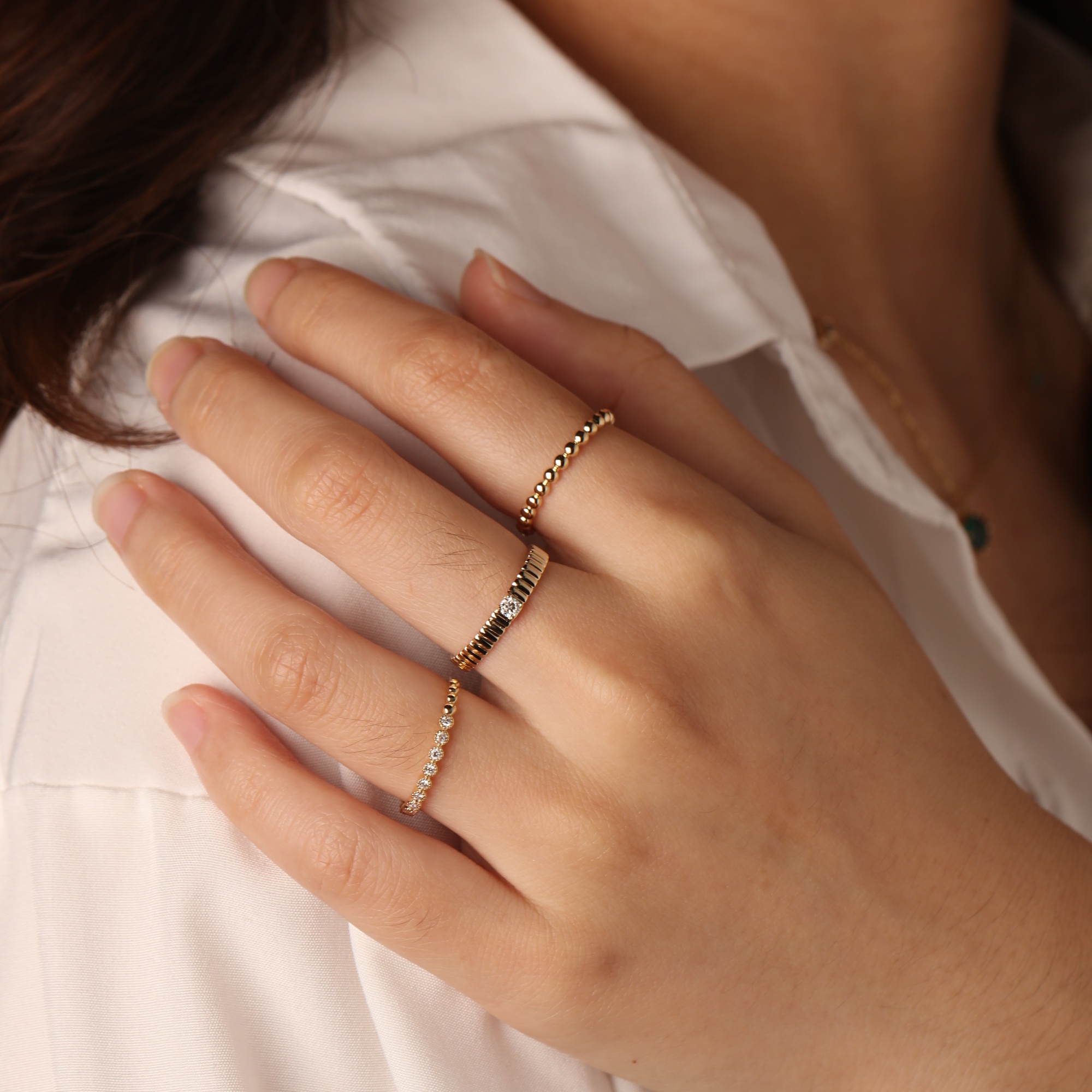 Woman wearing Frank & Label jewellery while reading